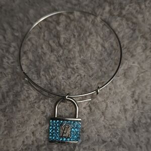 Silver-Tone Bangle Bracelet with Blue Crystal Padlock Charm